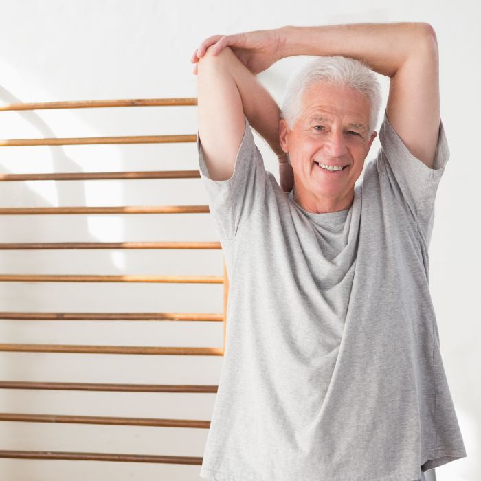 an older man stretching